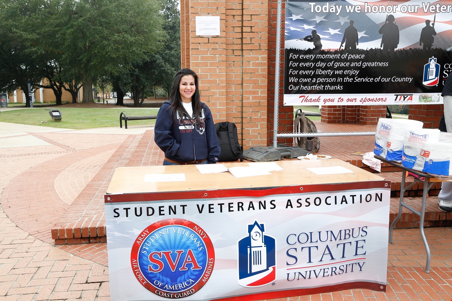 a student behind a booth