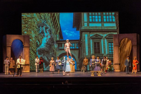 Several students on a stage performing an act