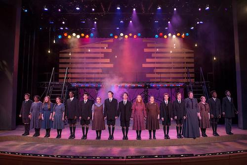 several people standing side by side in a line