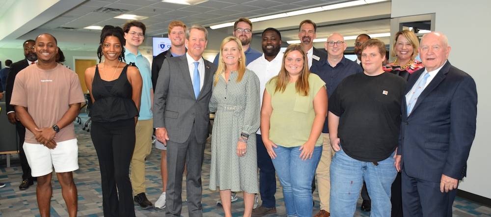 Governor Brian Kemp in a photo with students of the Cyber Security program at Columbus State University.