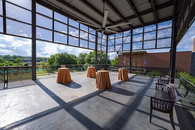 text-sm circular tables next to a sunny view