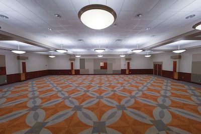 covered circular tables with artworks on the wall